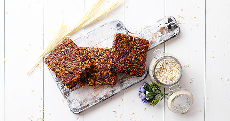 Image showing Closeup of whole grain bread with sunflower seeds on a rustic wooden board