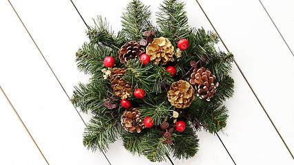 Image showing Christmas Wreath on White Wooden Background