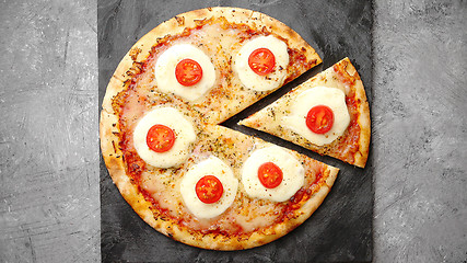 Image showing Homemade pizza with tomatoes, mozzarella