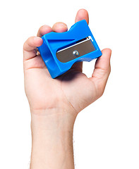 Image showing Hand with sharpener pencil