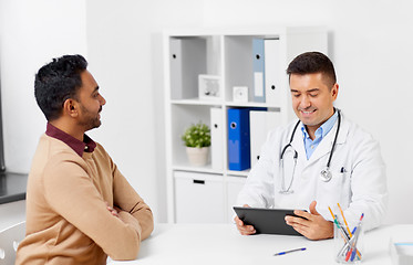 Image showing doctor with tablet pc and male patient at hospital