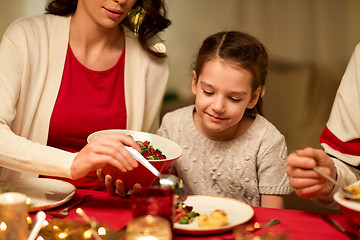 Image showing happy family having christmas dinner at home