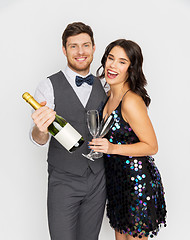 Image showing happy couple with champagne and glasses at party