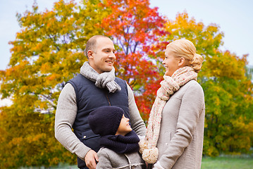 Image showing happy family over autumn park background