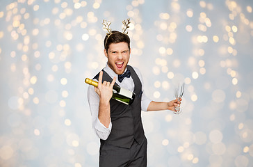 Image showing man with bottle of champagne at christmas party