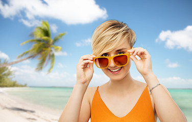 Image showing portrait of smiling young woman in sunglasses