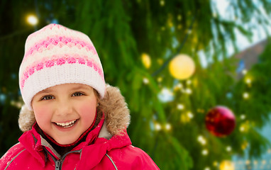 Image showing happy little girl in winter clothes outdoors