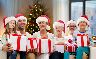 Image showing happy family with christmas gifts at home