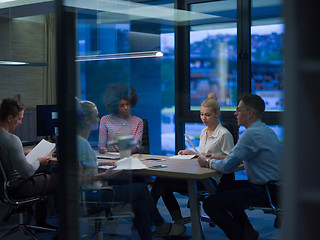 Image showing Multiethnic startup business team in night office