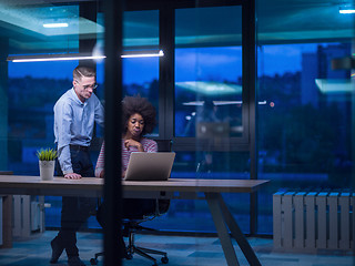 Image showing Multiethnic startup business team in night office