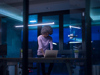 Image showing black businesswoman using a laptop in startup office