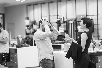 Image showing couple chooses shoes At Shoe Store