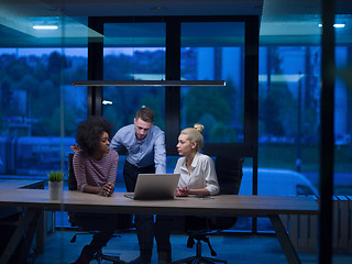 Image showing Multiethnic startup business team in night office