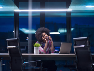 Image showing black businesswoman using a laptop in startup office