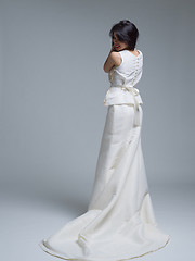 Image showing Rear view of a beautiful young woman in a wedding dress