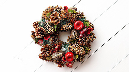 Image showing Christmas Wreath on White Wooden Background