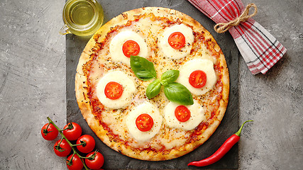 Image showing Homemade pizza with tomatoes, mozzarella