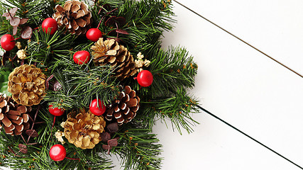 Image showing Christmas Wreath on White Wooden Background