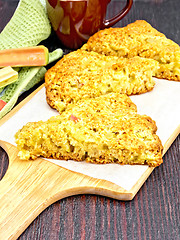 Image showing Scones with rhubarb on wooden board