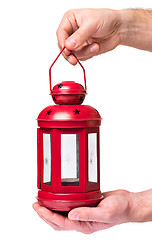 Image showing Hand holding red lantern