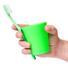 Image showing Hand with toothbrush on white 