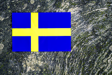 Image showing Swedish flag on mossy rock background