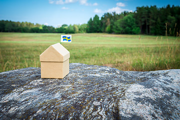 Image showing Little cardboard house in Swedish summer landscape