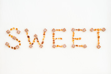 Image showing SWEET written with brown sugar pieces