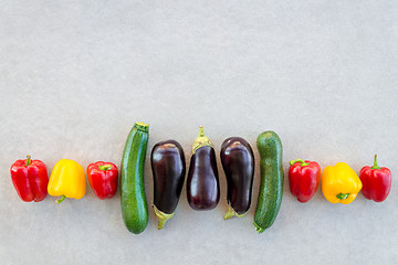 Image showing Row of colorful summer vegetables on concrete background