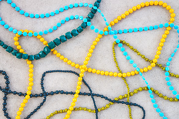 Image showing Colorful necklaces on concrete background