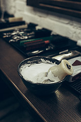 Image showing Barber shop tools on the table. Close up view shaving foam.