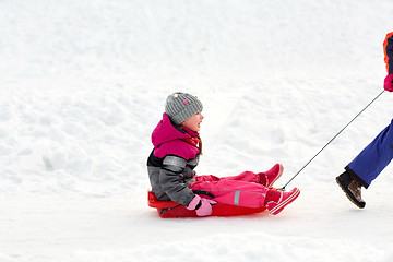 Image showing girls with sled having fun outdoors in winter