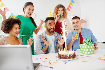 Image showing office team greeting colleague at birthday party