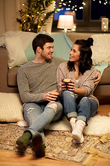 Image showing happy couple drinking coffee and eating at home