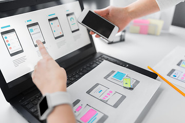 Image showing web designers work on smartphone user interface