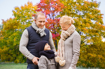 Image showing happy family over autumn park background