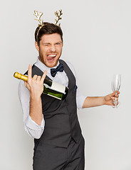 Image showing man with bottle of champagne at christmas party