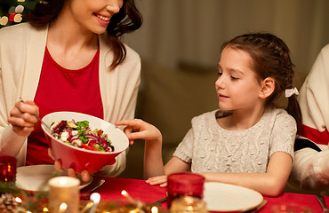 Image showing happy family having christmas dinner at home