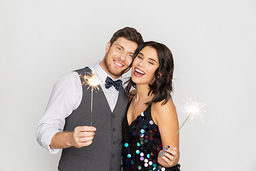 Image showing happy couple with sparklers at party