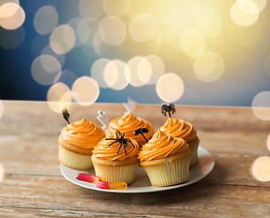 Image showing halloween party decorated cupcakes on plate