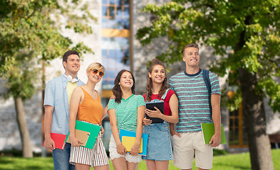 Image showing students with books and folders over campus