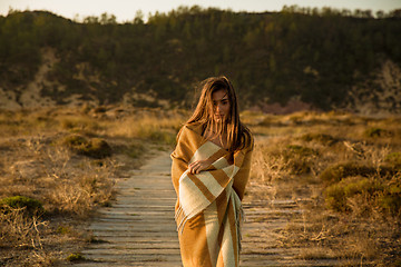 Image showing Beautiful woman wrapped in a wool towel