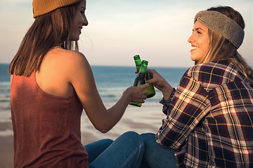 Image showing Making a toast on the beach