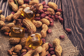 Image showing Natural peanut with oil in a glass