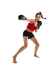 Image showing Fit beautiful woman with the boxing gloves isolated on white background