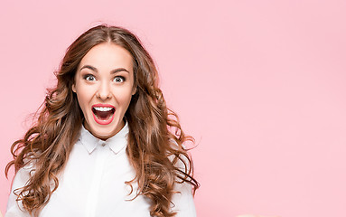 Image showing Surprised happy beautiful woman looking in excitement.