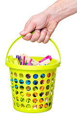 Image showing Hand hold bucket with clothespin