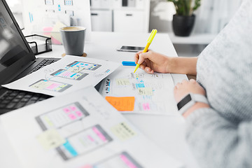 Image showing web designer working on user interface at office