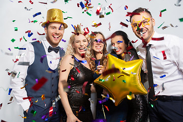 Image showing friends with party props and confetti laughing