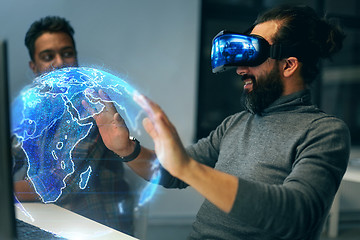 Image showing man in vr headset with earth hologram at office